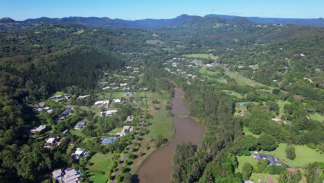 residential area with river in currumbin valley, gold coast, qld, australia - aerial drone shot