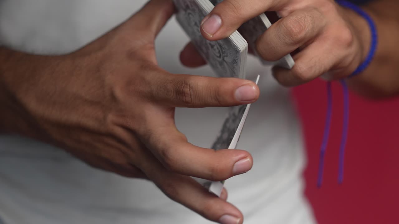 Magician showing tricks with cards