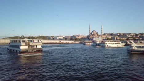 Evening,-cinematic-slow-mo,-a-view-of-Eminonu-from-a-ferry-on-the-Golden-Horn-in-Istanbul