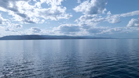 aerial view of the tranquil waters of the flat head lake in motana with stratus clouds