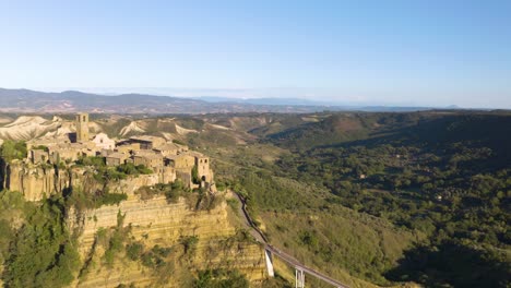 amazing aerial drone shot reveals hilltop village civita di bagnoregio in lazio, italy