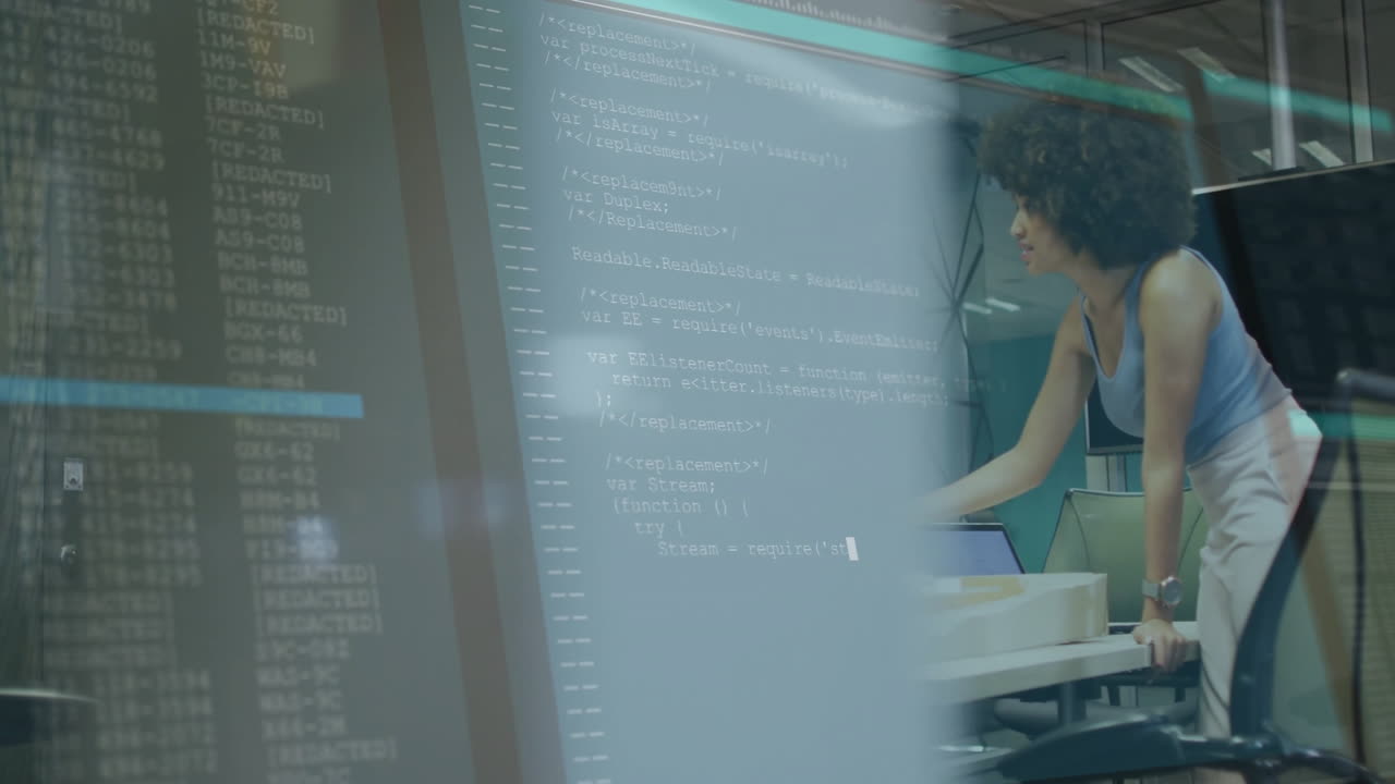 Woman working at computer with code and data processing animation overlay
