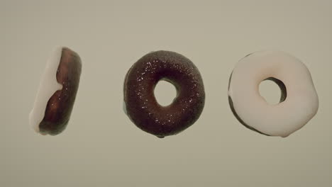 white glaze donuts on a light green background