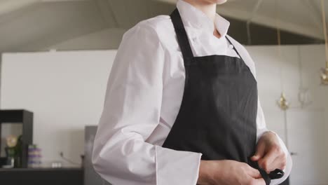 chef putting on her apron