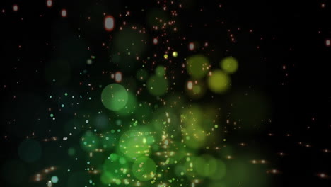 green and yellow glowing particles animation over dark background with bokeh effect