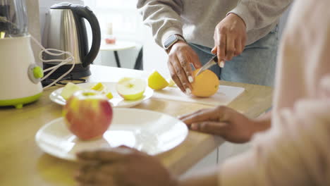 Women cutting fruits