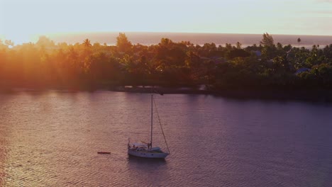sailboat vallee de tautira bay river north shore taiarapu taravao tahiti island french polynesia aerial drone windy warm golden sunrise vaitia village south pacific ocean teahupo papeete static