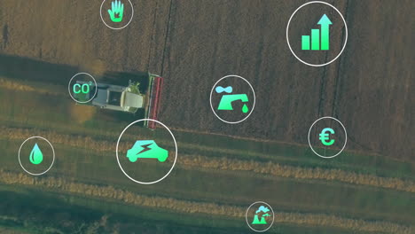 combine harvester being animated cutting crops into strips leaving stubble, floating eco icons