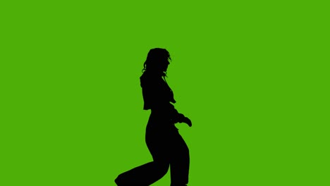 studio silhouet van vrouw dansen tegen groene achtergrond 3