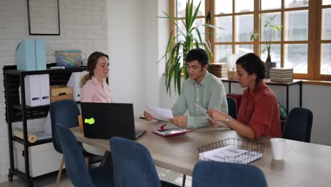 multi-ethnic business colleagues having a business talk during meeting in modern workplace