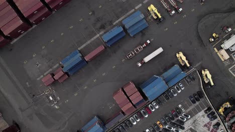 overhead of trucks and intermodal containers in an industrial shipping yard