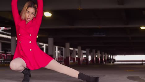 within the bustling city's parking garage, a young girl of hispanic heritage dons a short red dress