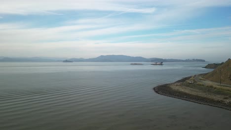 aerial drone view of point molate beach in richmond, california, showcasing its rugged shoreline, calm bay waters, and scenic coastal beauty.