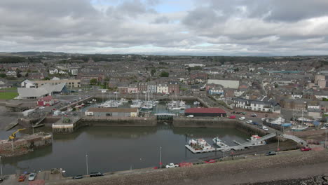 an aerial view of arbroath harbour and town on a cloudy day