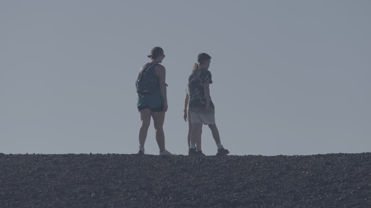 Family Walking on a Rocky Horizon