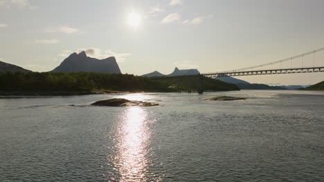 glistening water at kjerringstraumen bru on the efjorden during sunrise in nordland county, norway