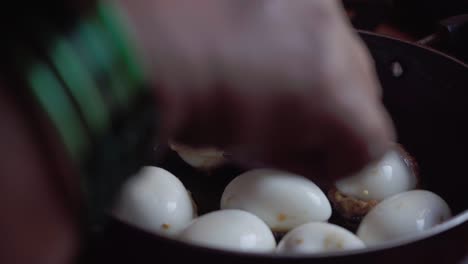 a flipping pan-frying boiled egg in oil homemade deviled egg is also known as stuffed eggs, russian eggs, or dressed eggs