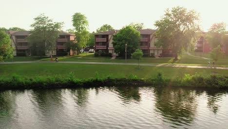 super-slow-motion-sunset-aerial-above-lake-Big-Bear-Lake-in-Century-Park-from-Vernon-Hills-Illinois-USA