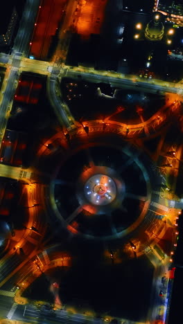 circling above the logan square in philadelphia, pennsylvania, usa. drone footage above the night city with multiple lights. vertical video
