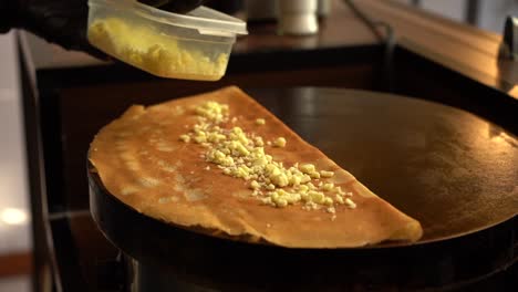 adding preparing cheese crepe slow motion