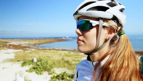 Female-cyclist-wearing-sunglasses-in-countryside-4k