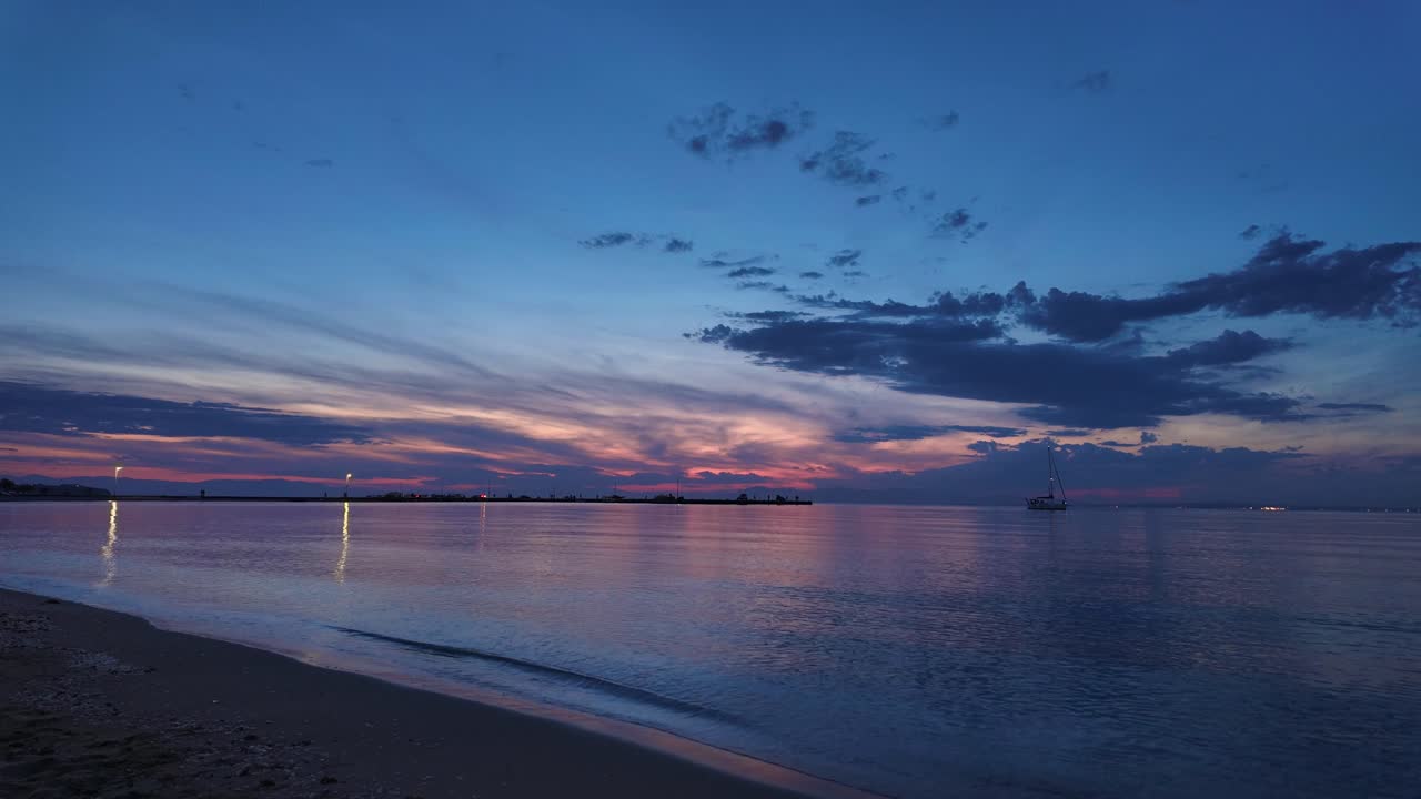 Beach sunset timelapse Peraia Greece summer holiday peaceful golden hour skyline sea waves