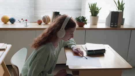 Teenage Girl Studying in a Classroom