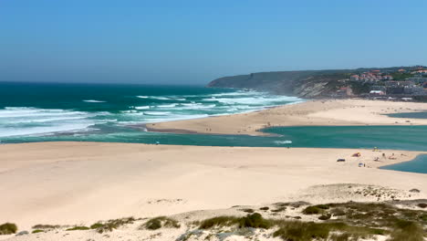 panoramic view of the beach and the obidos lagoon in foz do arelho at noon, portugal.