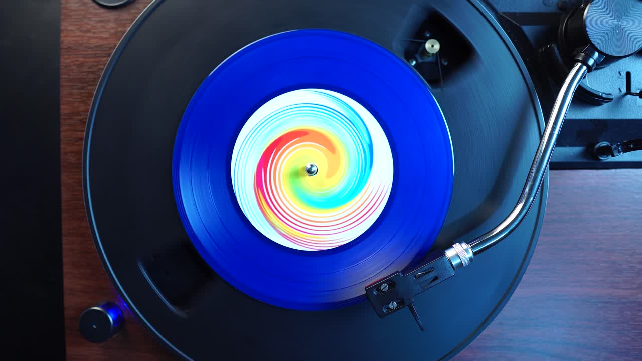 Vinyl Audio Record, Starting Playback of Blue Single Record on Turntable, Top Down View