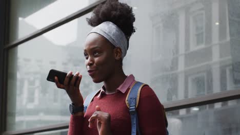 african american talking on her smartphone in street