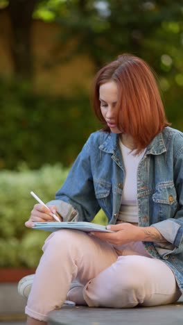 woman working on a tablet outdoors