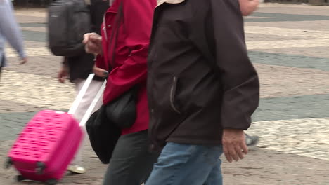 older couple walking in city street