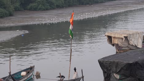 indias flag flying on the boat