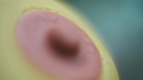 macro hyper close up shot of a silicone nipple, baby equipment, health care, full hd , pull out crane movement