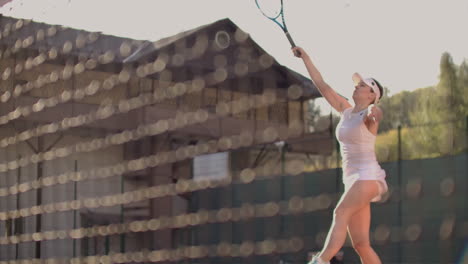 Tennis-Player-Reaching-To-Hit-Ball.-Female-tennis-player-reaching-to-hit-the-tennis-ball-on-court