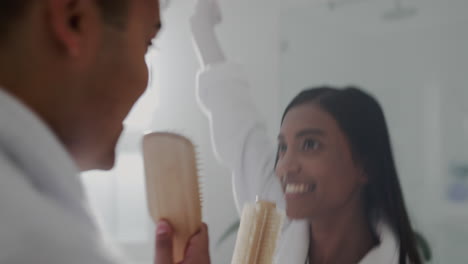 Singer,-happy-and-dance-with-couple-in-bathroom