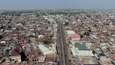 Busy-highway-in-Gombe,-Nigeria---descending-aerial-city-view