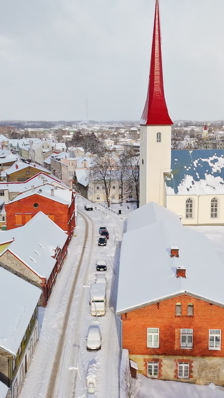 Vertical aerial of snowy streets and the church, winter day in Rakvere, Estonia