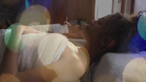 relaxing in spa, people lying on beds with bokeh lights animation