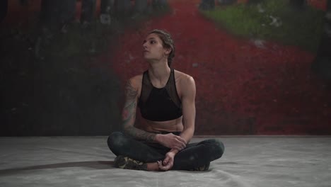 woman rock climber taking a break
