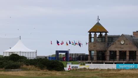 golf event setup with flags and tents