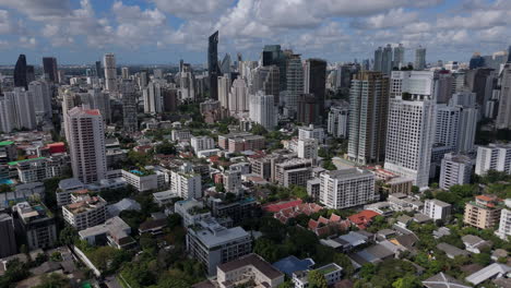 high rise buildings in the phrom phong urban area in bangkok, thailand. aerial drone shot