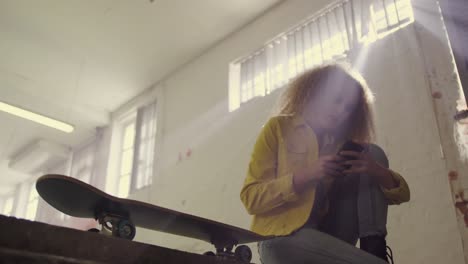 fashionable young woman in an abandoned warehouse