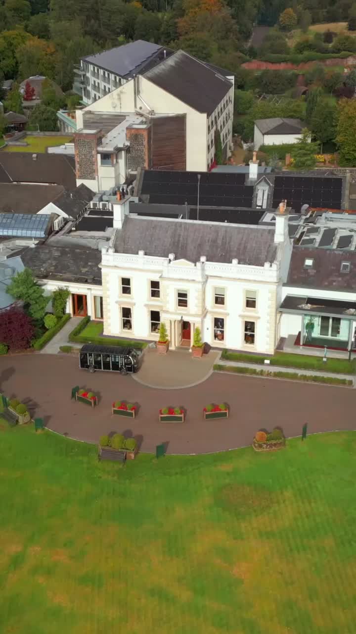 Rising social ratio 60FPS aerial of Galgorm Estate in Ballymena, County Antrim in Northern Ireland. Produced in 1080x1920 with broadcast ready Rec709 color
