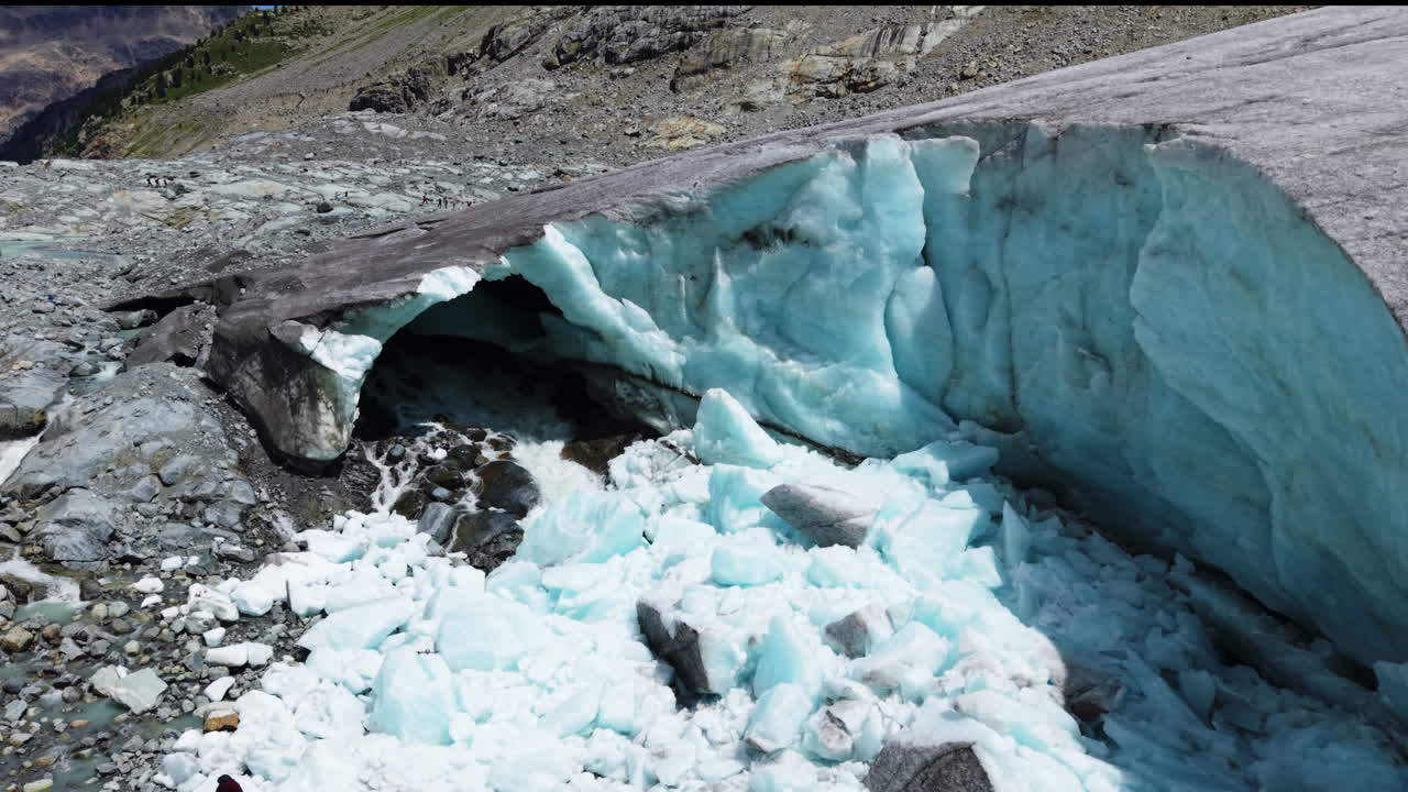 Glacial ice melting in Morteratsch, Switzerland under rocky terrain