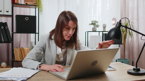 Nervous-stressed-businesswoman-manager-quarrelling-laptop-call-online-talking-aggressively-at-office