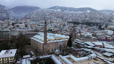 aerial view of grand mosque of bursa during winter in bursa, turkey - drone shot