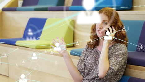 animación de una red de conexiones con iconos sobre una mujer caucásica usando un teléfono inteligente