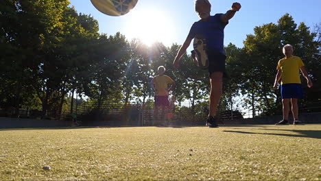 senior football player taking the penalty kick while playing soccer with his friends outdoors