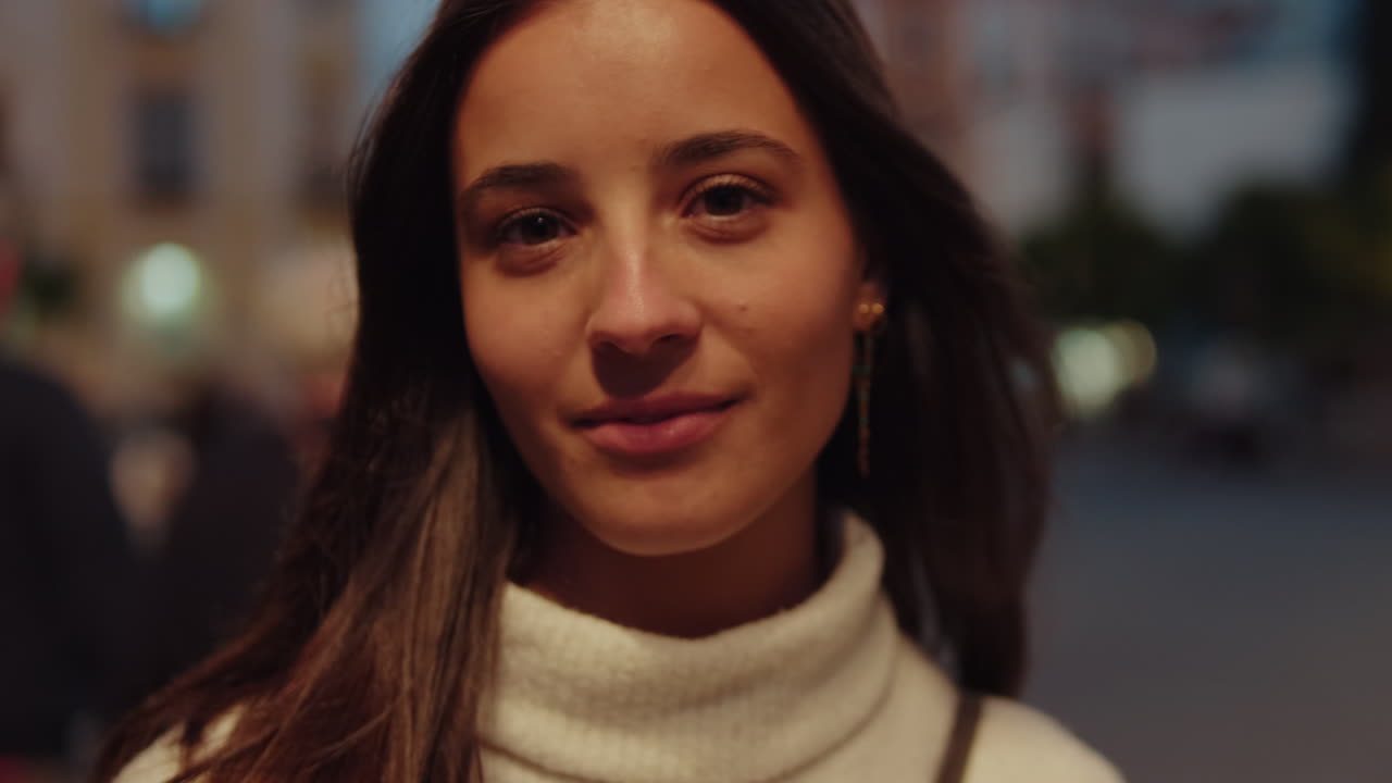 Young Woman Smiles in Seville at Night